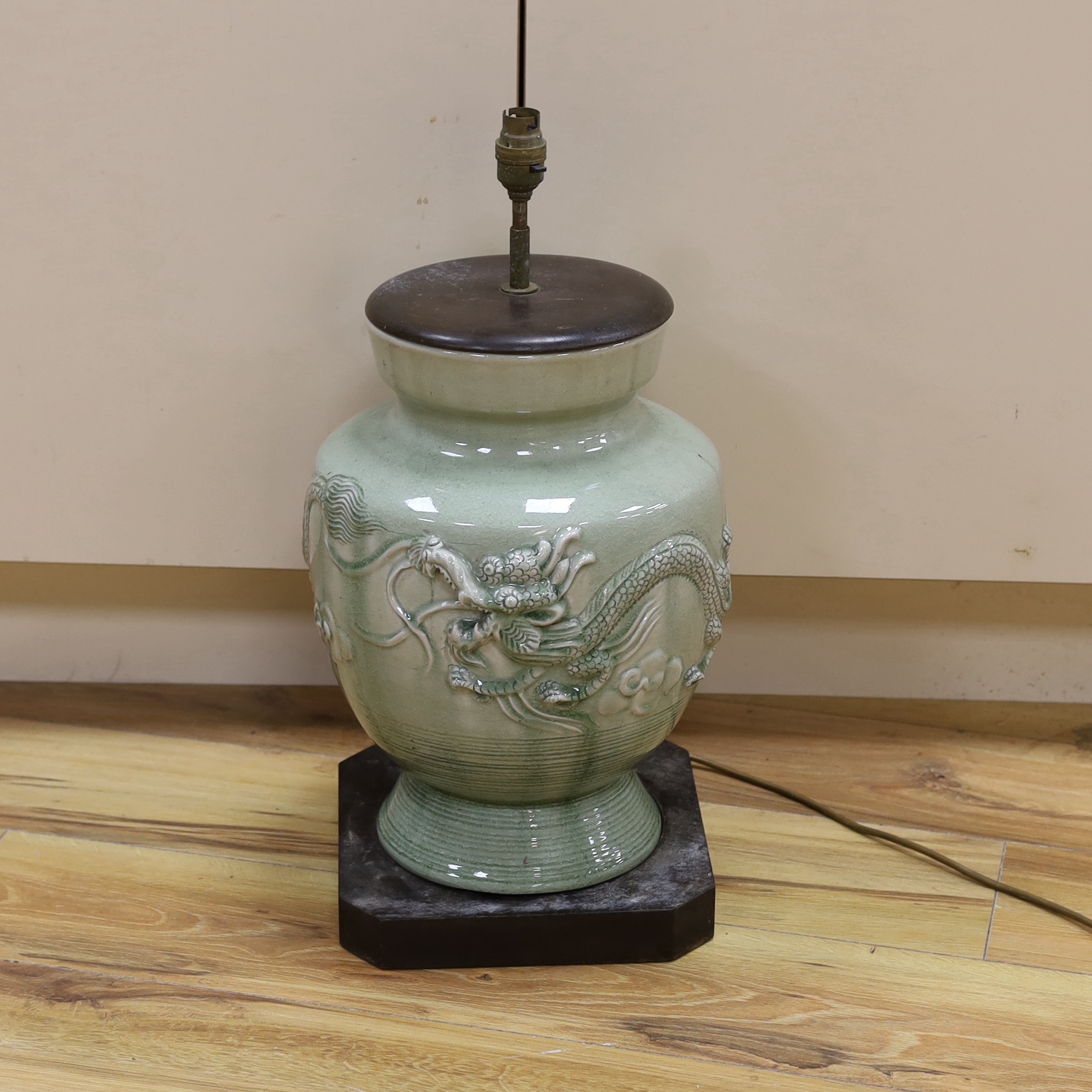 A Chinese celadon glazed lamp, 55cm high